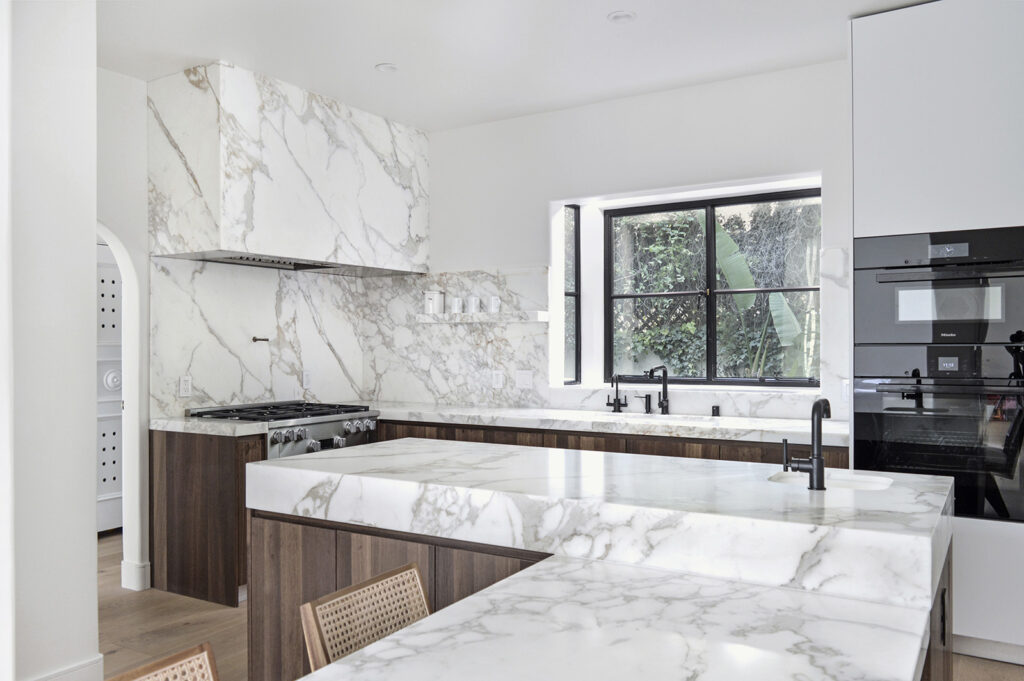 Calacatta Borghini featured on kitchen countertops and walls